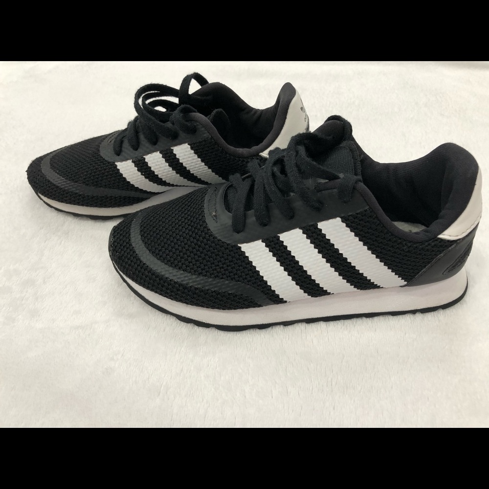 Black and white Addidas shoes
